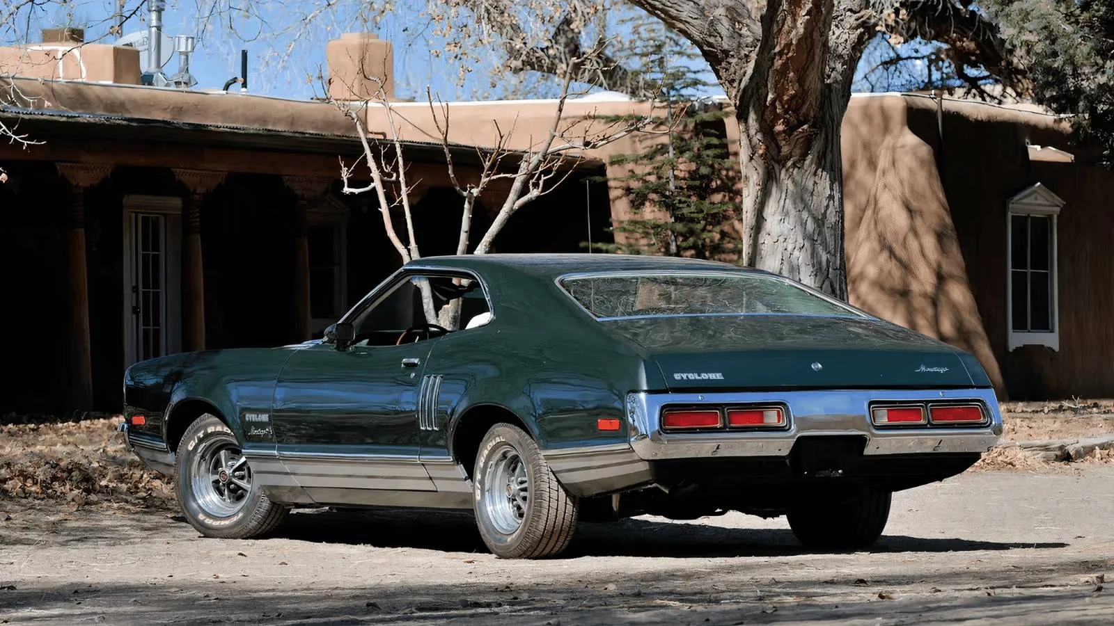 A beautiful 1972 Mercury Montego GT Cyclone in a showroom setting, showing the fastback roofline and Cyclone badging