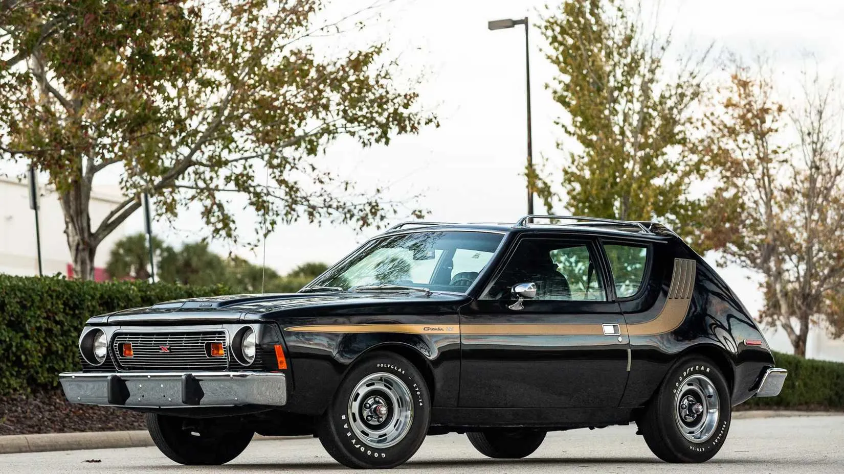 A front three-quarter shot of a restored 1977 AMC Gremlin X, highlighting its unique face