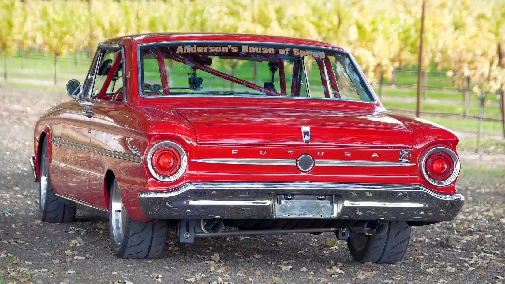 Rear view of the 1963 Ford Falcon Red Rocket during a drive