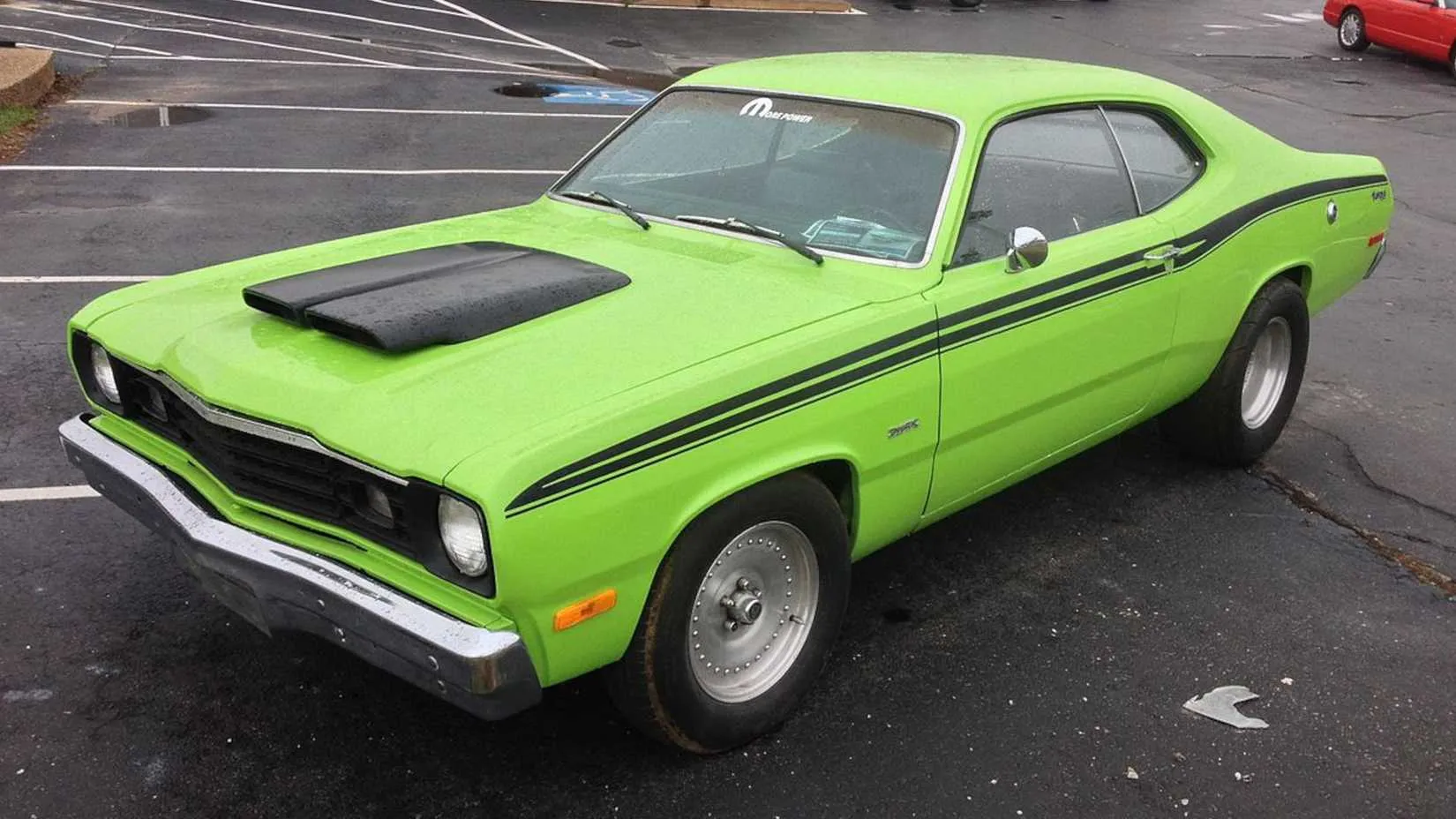 Front 3/4 view of a green 1973 Plymouth Duster Twister