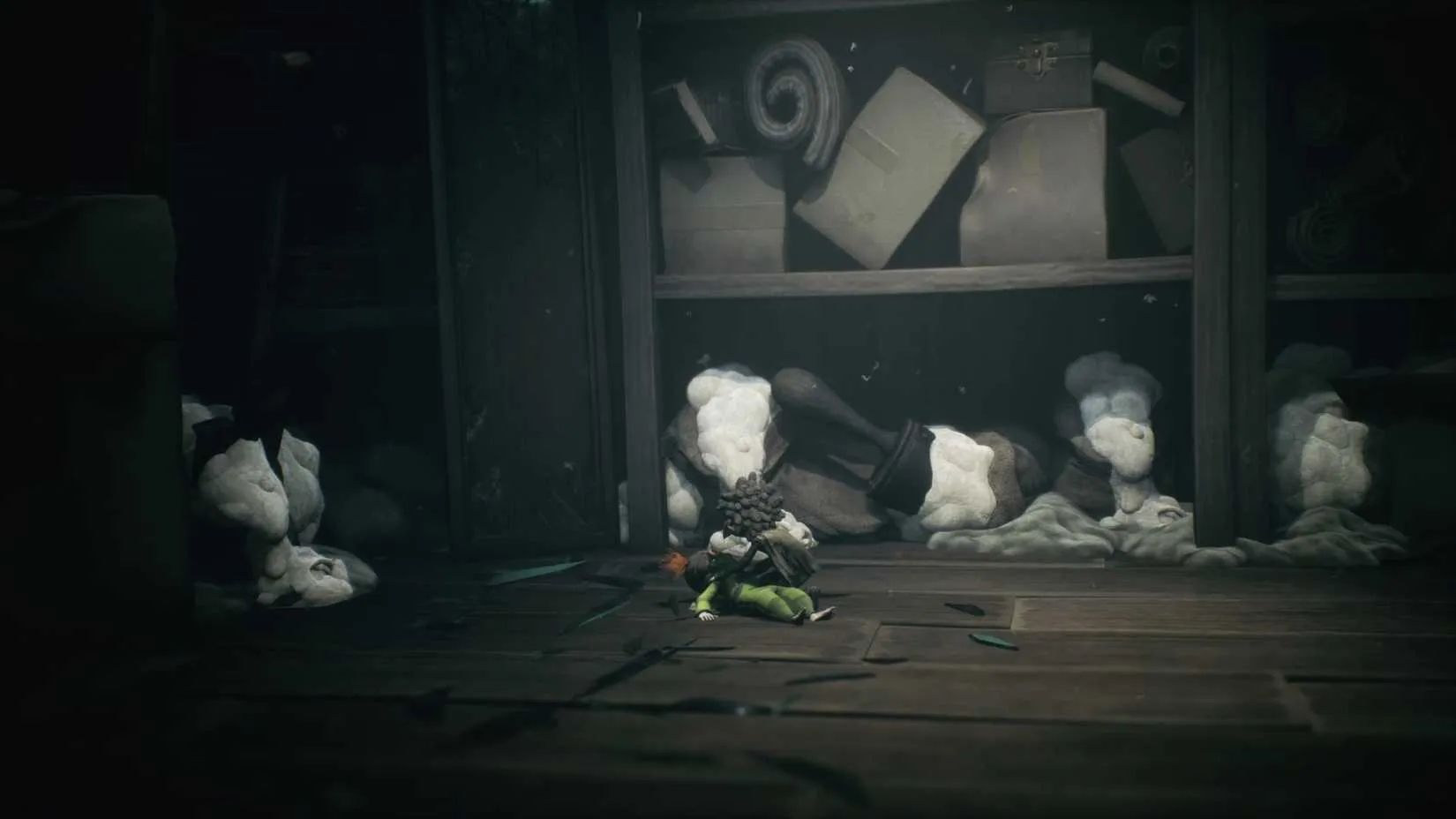 Low and Alone navigating through a dusty, abandoned room filled with giant everyday objects