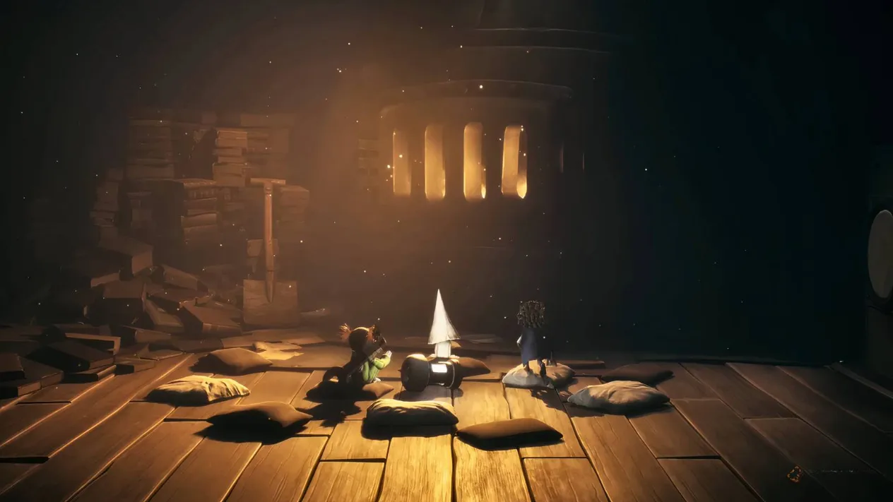 Low and Alone sitting next to a Nome on a cushion in Little Nightmares 3