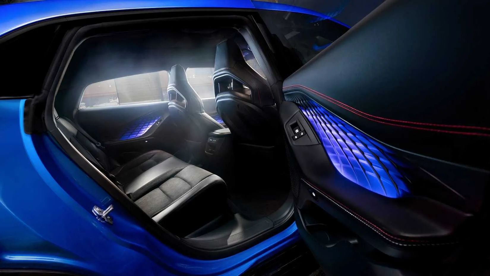 Interior of the 2026 Dodge Charger Daytona Scat Pack four‑door with red leather seats