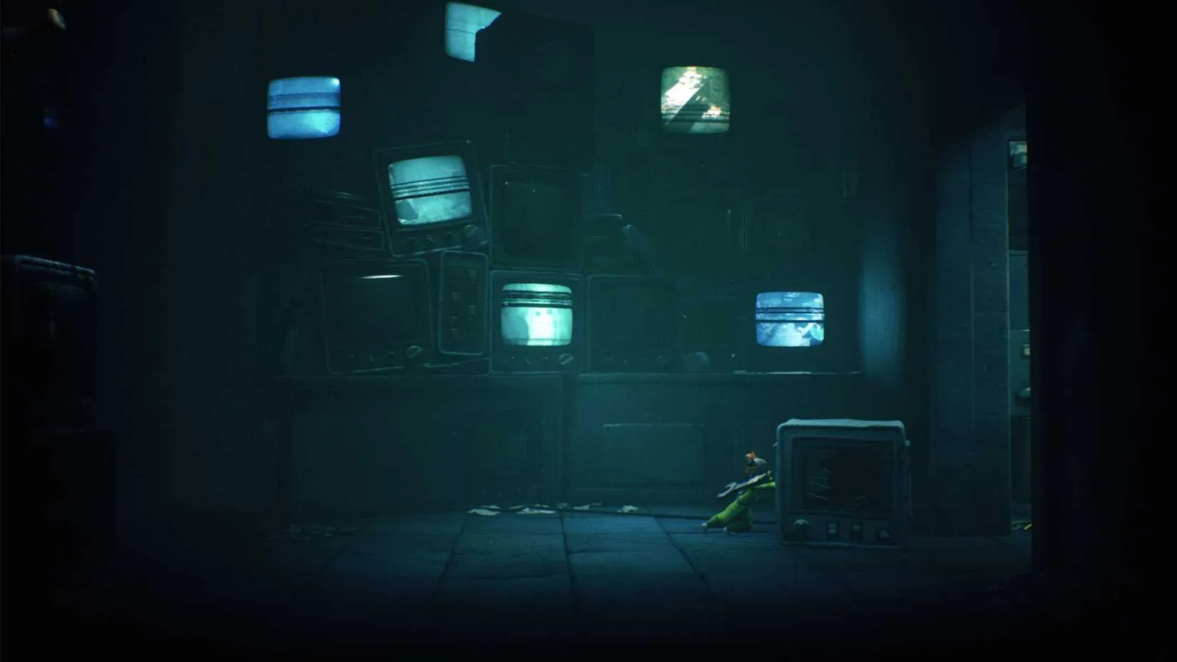 Pushing the broken TV to keep the door open for your partner