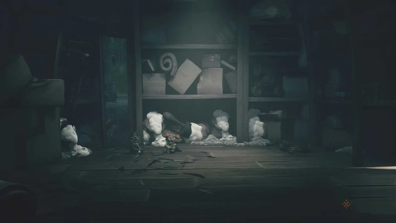 Low and Alone sitting on the floor next to a mirror in a dark room
