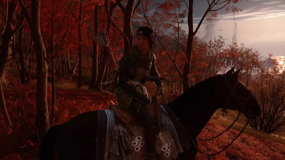 Atsu on horseback galloping through snowy mountains in Ghost of Yotei