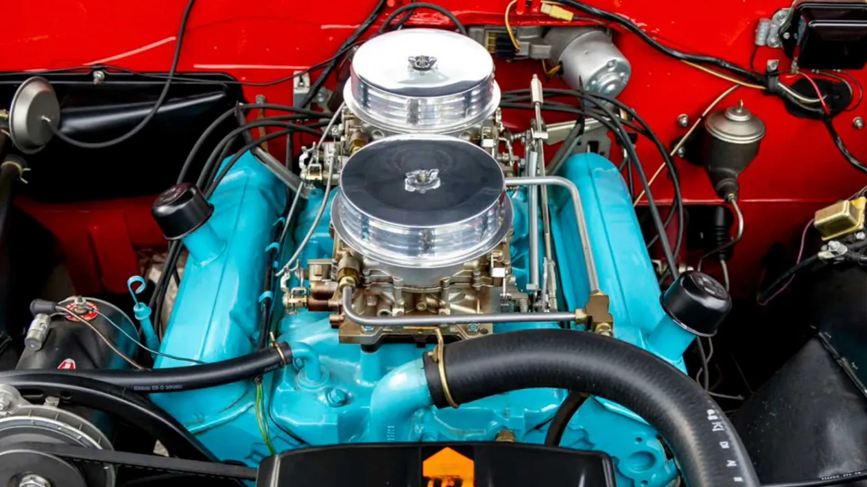 The legendary 1962 Pontiac 421 Super Duty V8, dressed with chrome and sporting dual four-barrel carburetors, representing the peak of early Super Duty development