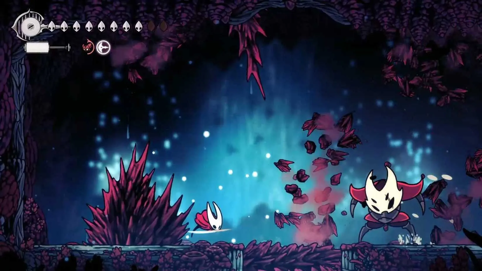 A towering coral warrior stands in an underwater arena, preparing to summon stalactites