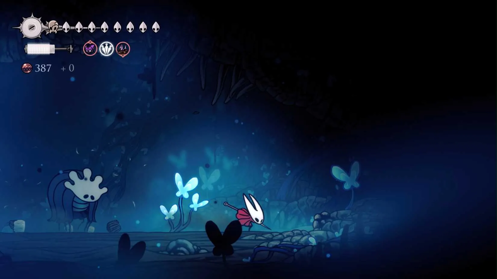 A bloated, lifeblood-infected creature standing in a glowing chamber