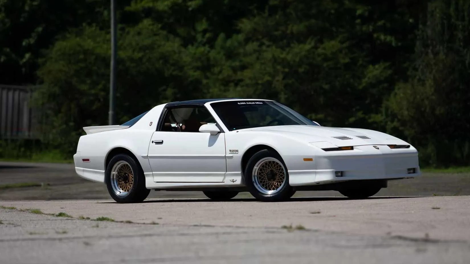 front quarter shot of a white 1989 Pontiac Turbo Trans Am 20th Anniversary parked