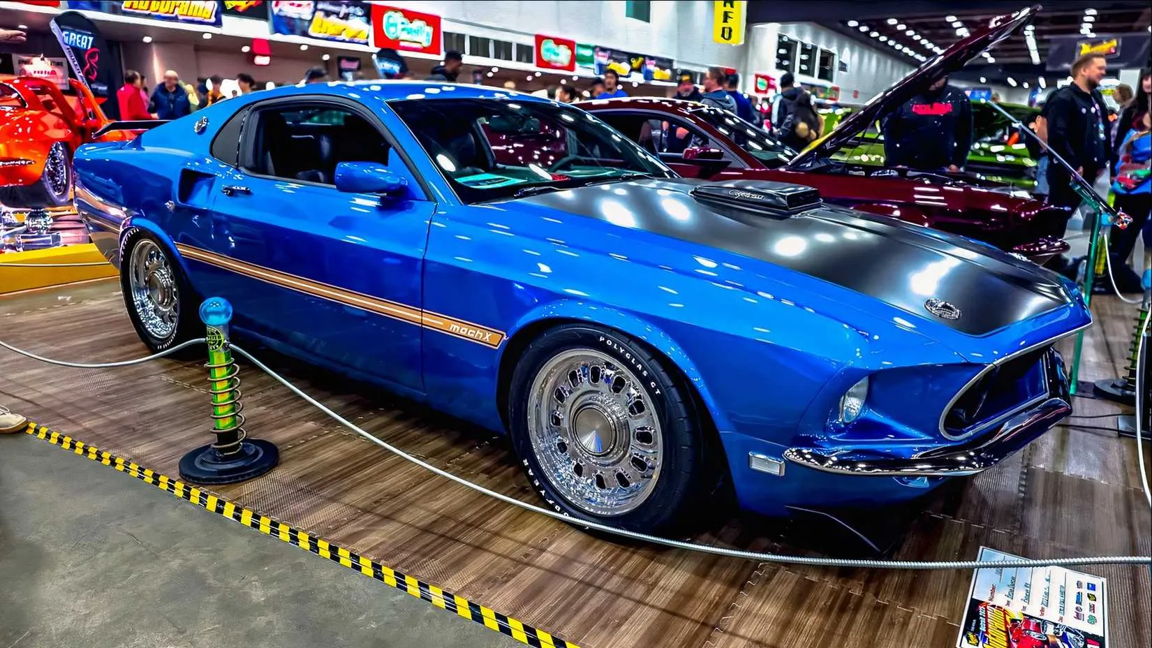Close-up of the custom hood and front end showing the 1969 Mustang grille and the custom Coyote 5.0 badge