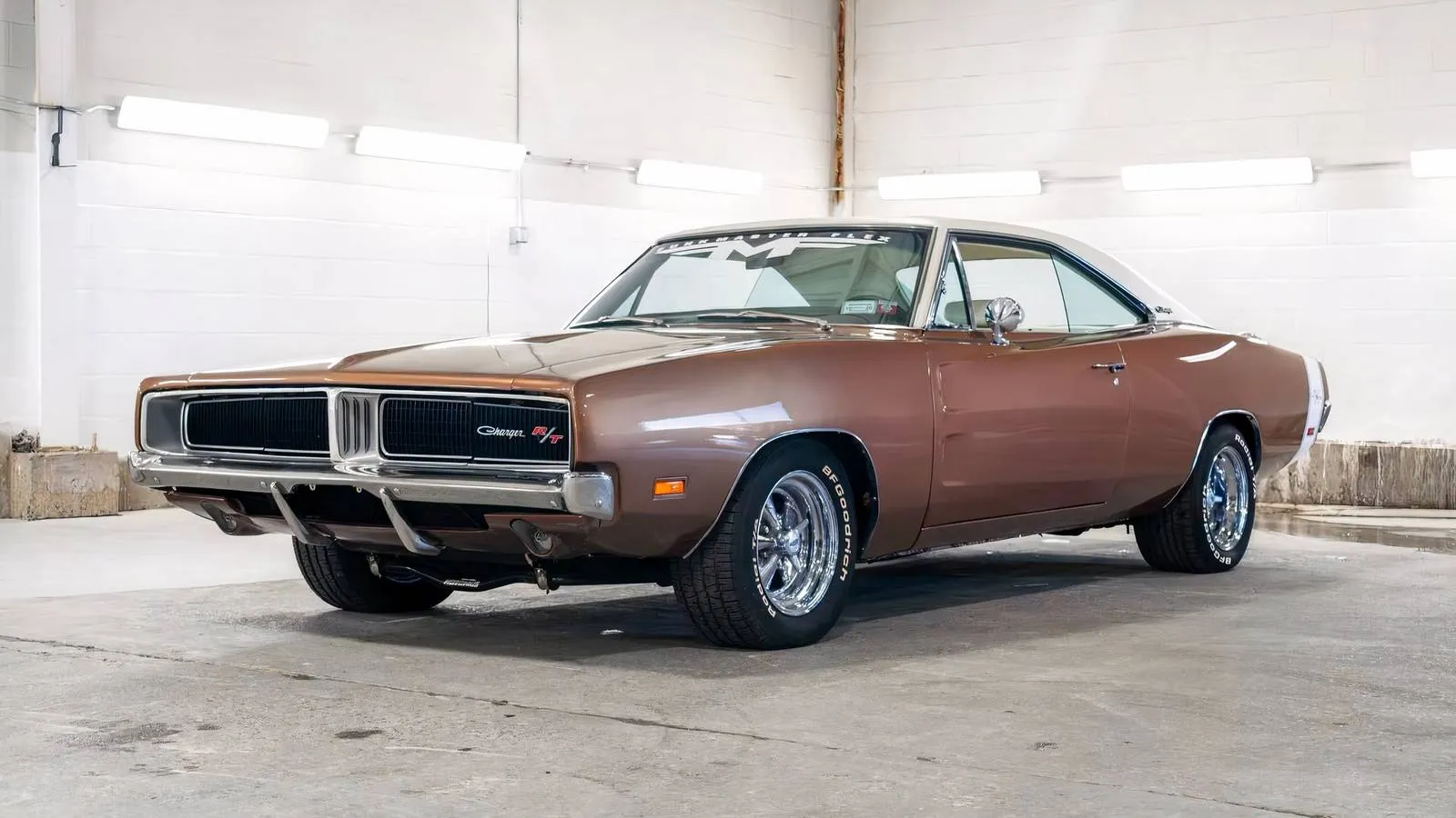 1969 Dodge Charger R/T in factory F8 Green parked on asphalt