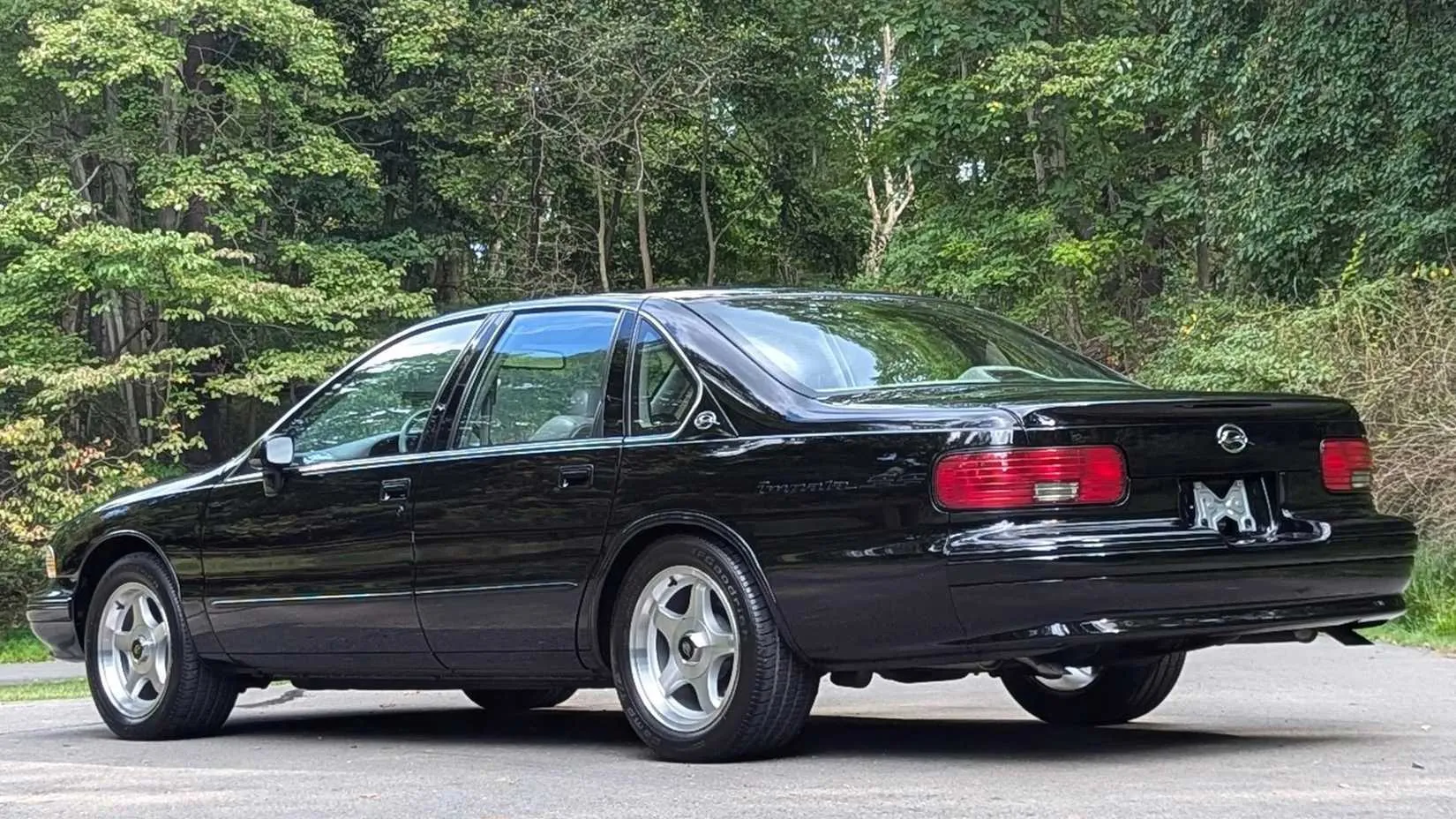 Rear three-quarter view highlighting the improved wheel arches and spoiler