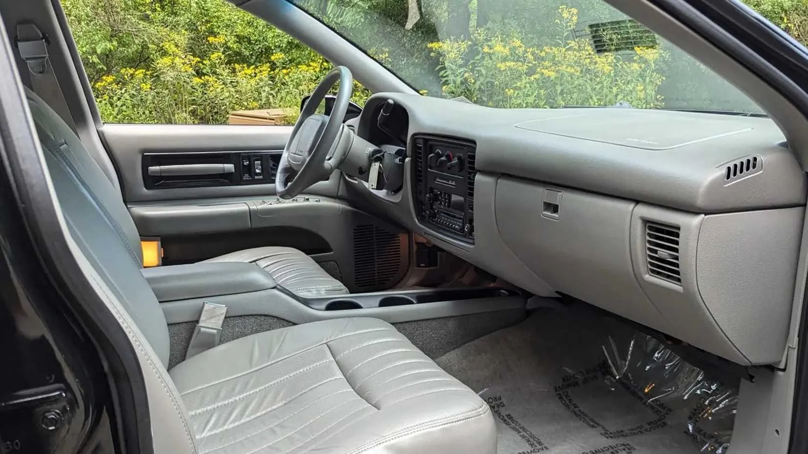Gray leather interior with analog gauges and column shifter