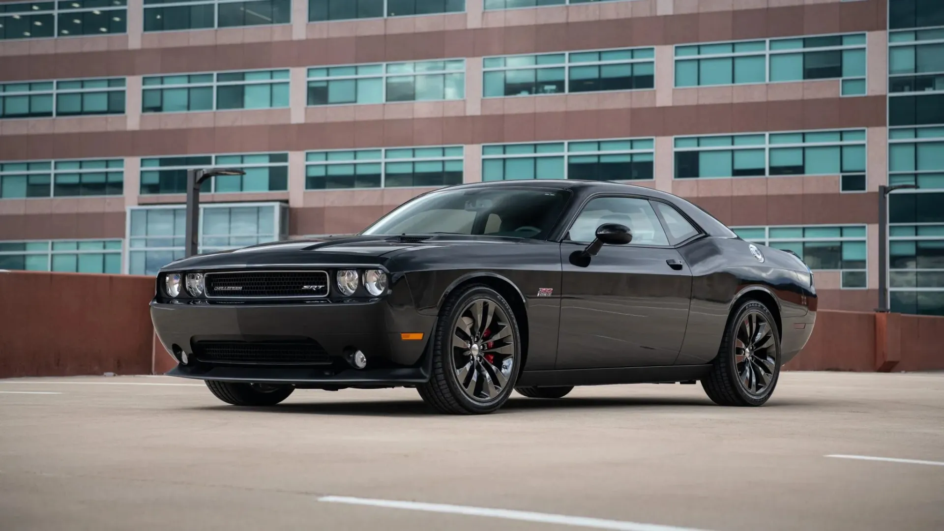Side profile of a 2013 Dodge Challenger SRT8 392, emphasizing the coupe silhouette and classic muscle proportions.
