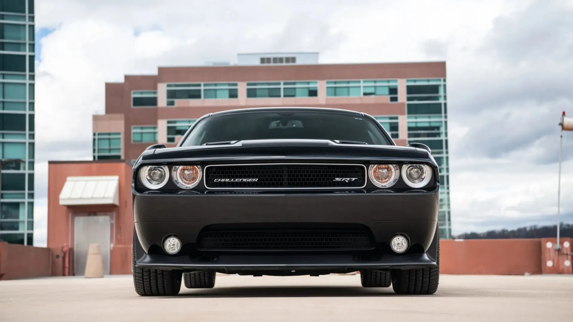 A pristine 2013 Dodge Challenger SRT8 392 interior and exterior shot combination showing the driver-focused cockpit.