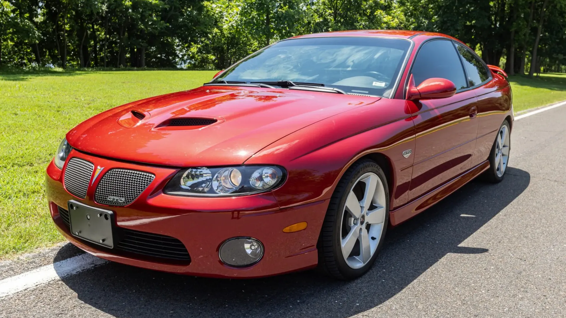 A 2006 Pontiac GTO with a manual transmission, showing off its subtle but muscular lines.
