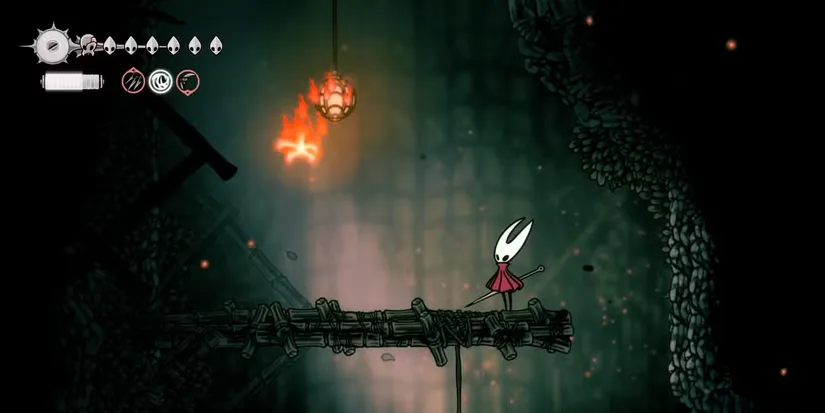 A bright, flaming Wisp floats in Wisp Thicket, an invulnerable homing projectile that makes exploration a frantic dodge-fest.
