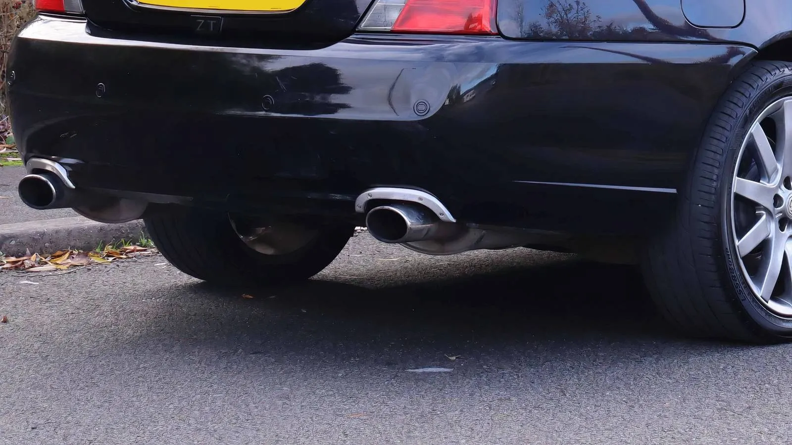 A rear view of a subtle green MG ZT 260, the only visual clues to its V8 heart being the twin exhaust tips and a small badge
