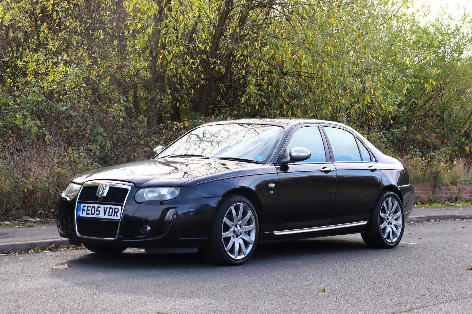 A front three-quarter shot of a 2005 MG ZT 260, looking unassuming in a parking lot