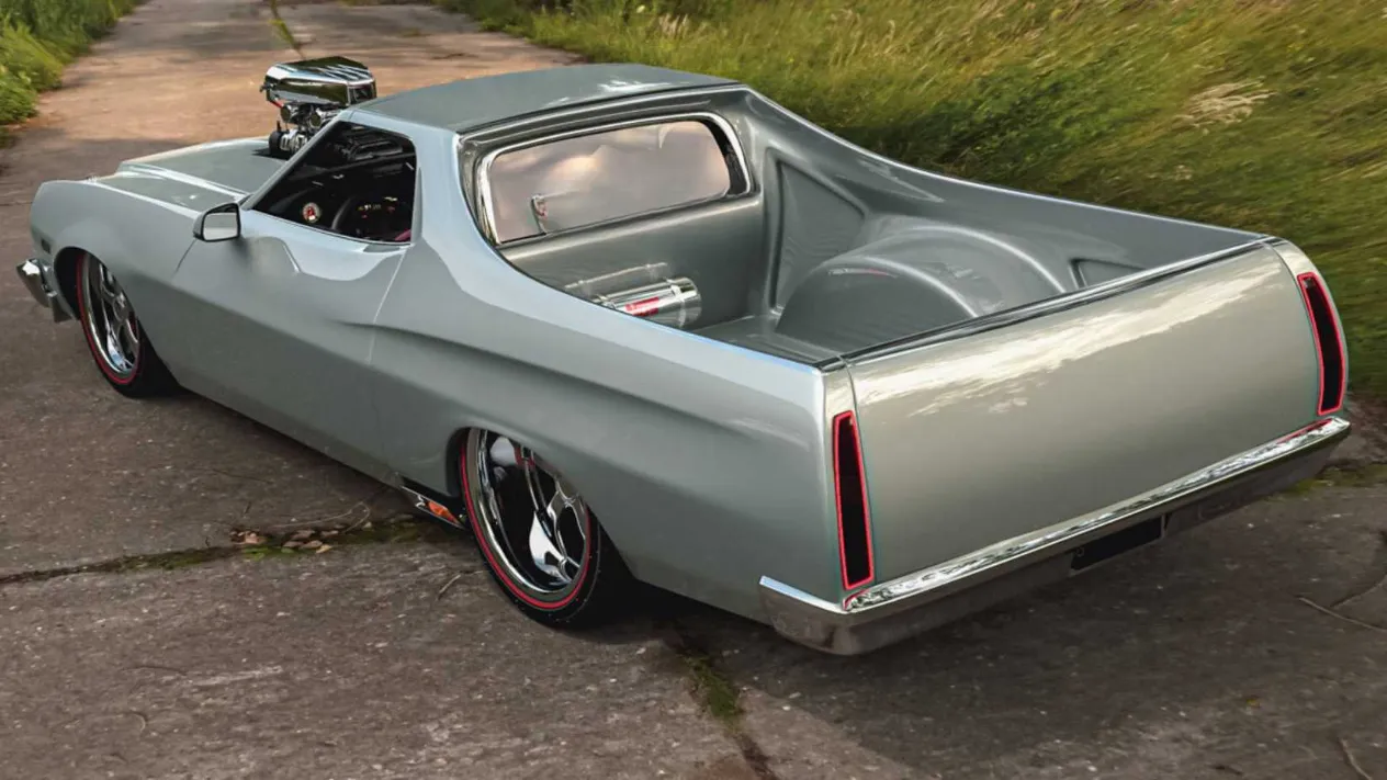 Close-up view of the Ranchero&rsquo;s blower emerging from the hood, emphasizing the aggressive restomod attitude.