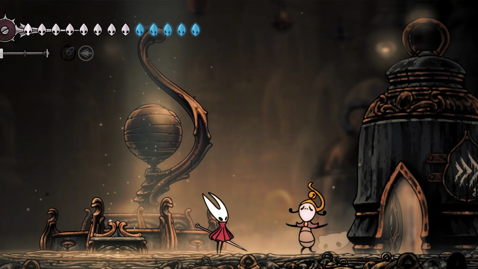 Hornet exploring the dark tunnels of the Wormways in Silksong