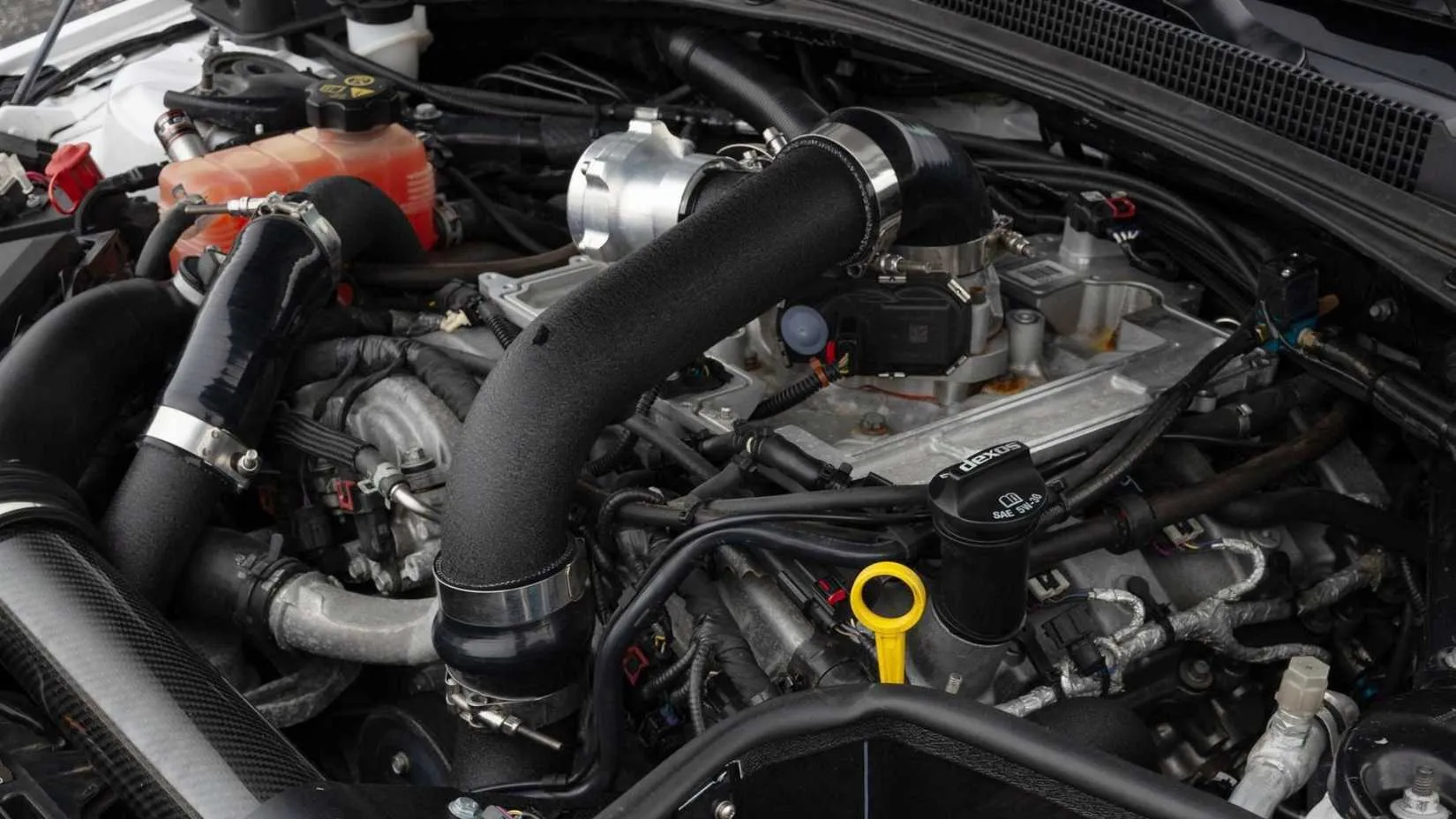 Engine bay of a heavily modified 2018 Cadillac ATS-V with upgraded turbochargers and supporting mods