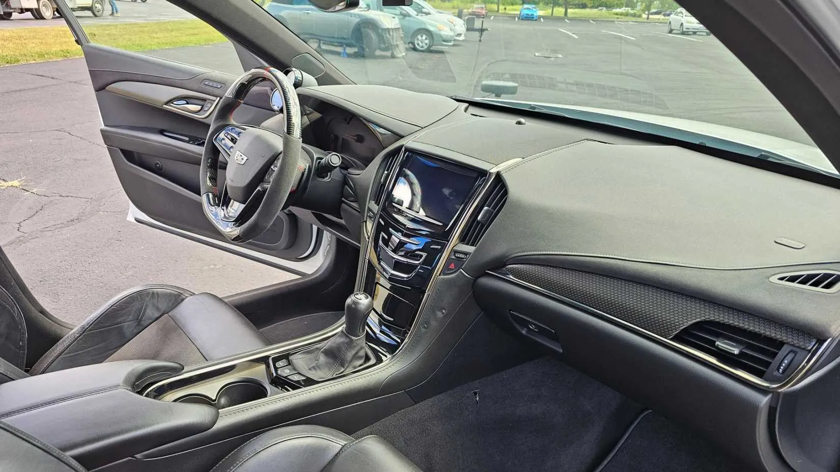 Interior of the modified 2018 Cadillac ATS-V showing the manual shifter and sport seats