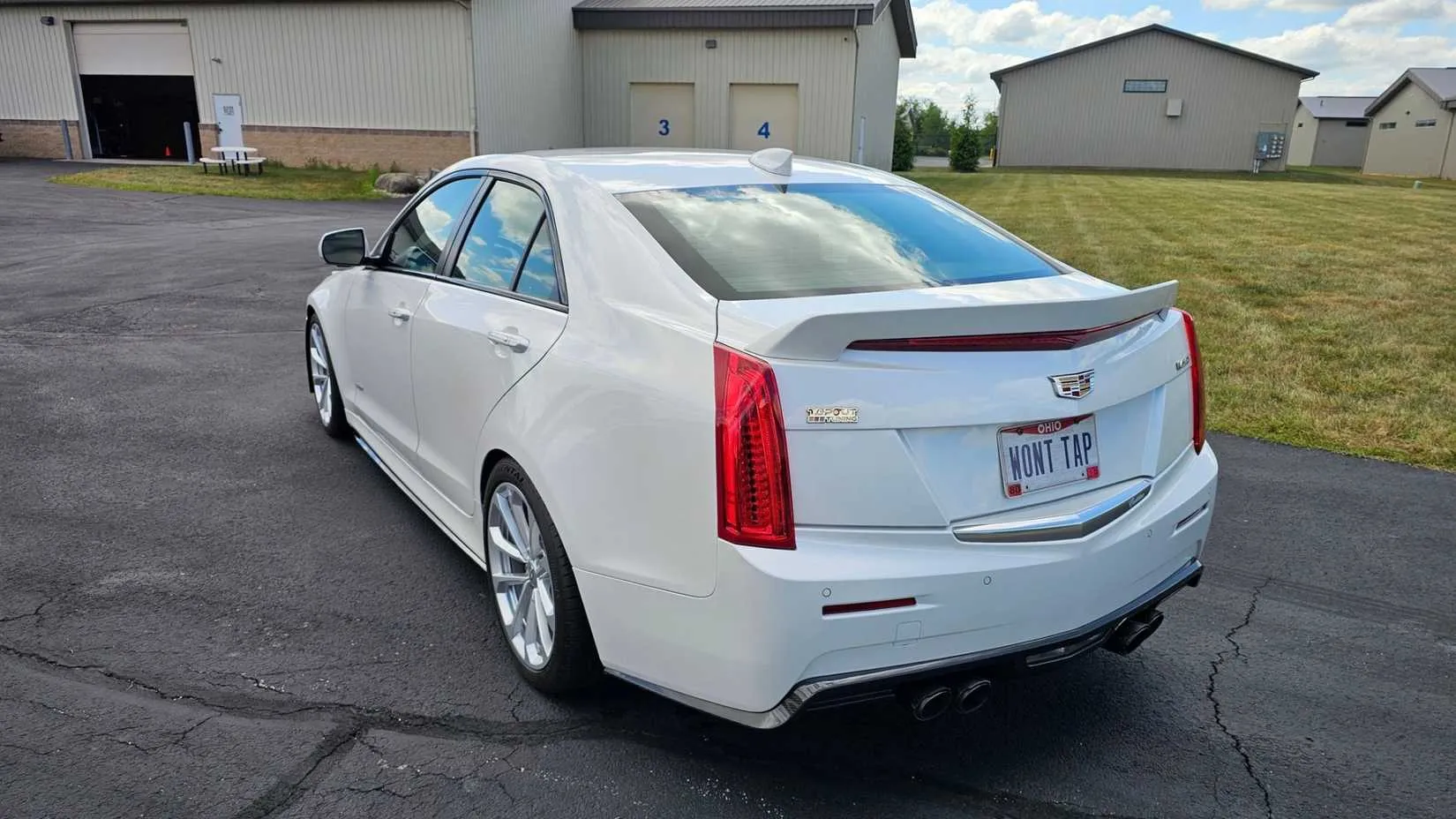 Rear three-quarter view of a heavily modified 2018 Cadillac ATS-V