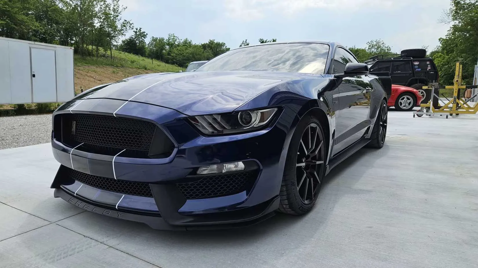 Blue Shelby GT350 front on the road