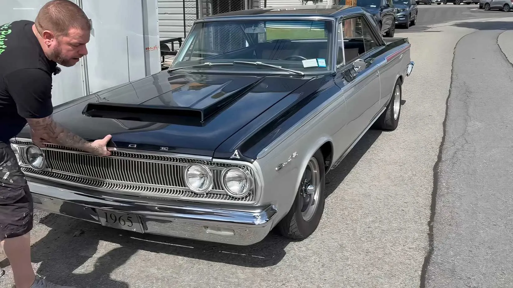 A restored 1965 Dodge Coronet with aftermarket upgrades, parked in a driveway