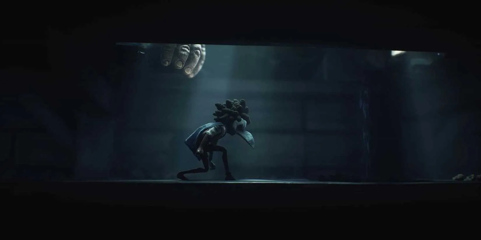 Hiding from a giant monster in Little Nightmares III